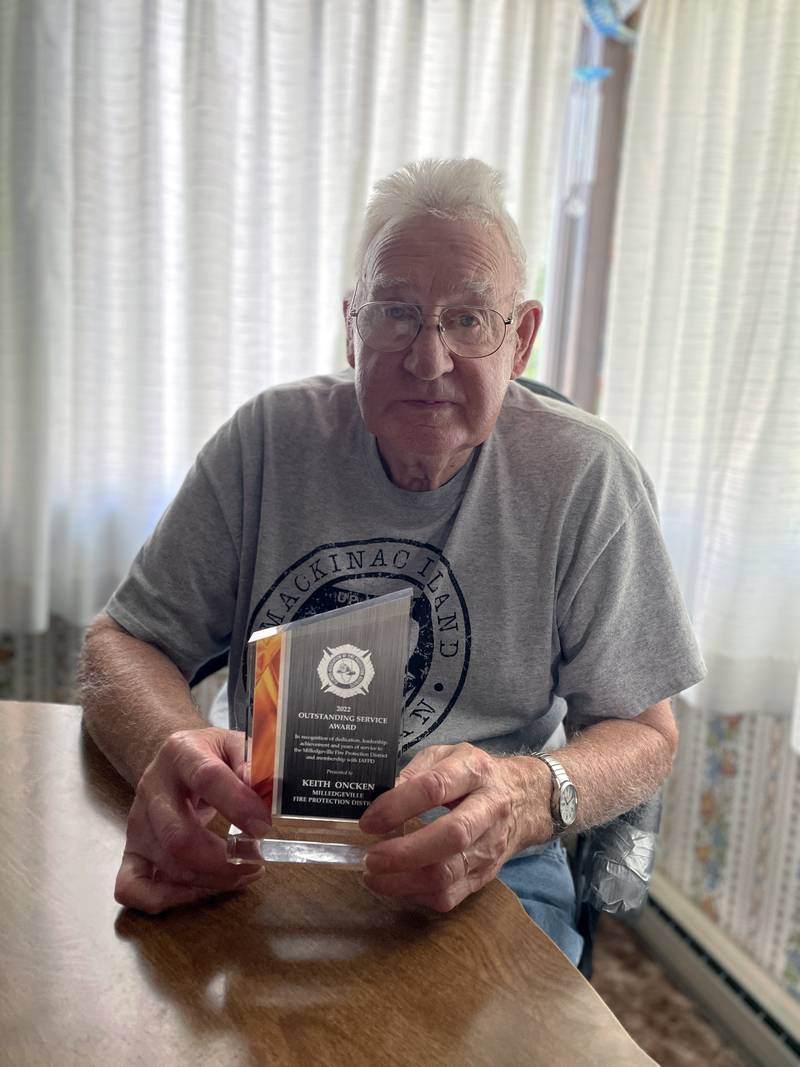 Keith Oncken, 90, of Milledgeville, holds his 2022 Outstanding Service Award trophy presented to him on June 24 by the Illinois Association of Fire Protection Districts for his 72 years of service to the Milledgeville Fire Protection District. Oncken served 18 years as an active firefighter and 54 years as a trustee. He recently was sworn in for another three-year term.