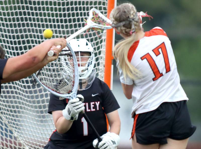 Crystal Lake Central United’s Ella Trudeau, right, fires the ball for a goal as Huntley’s goalkeeper Savannah Stone looks for a save in IHSA Sectional Title Game action at Crystal Lake Central High School in Crystal Lake on Friday, May 30, 2025.