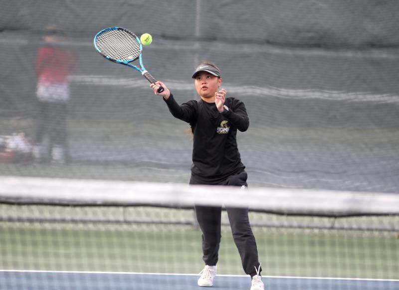 Sycamore’s Elizabeth Kleckner hits the ball during the first day of the IHSA state tennis tournament at Rolling Meadows High School on Thursday, Oct. 20, 2022.