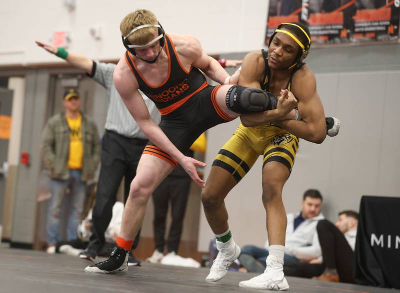 Joliet West’s Aiden Brown looks to bring down Minooka’s Kaden Meyer in the Class 3A Minooka Regional 165 pound championship on Saturday, Jan. 31, 2026 in Minooka.