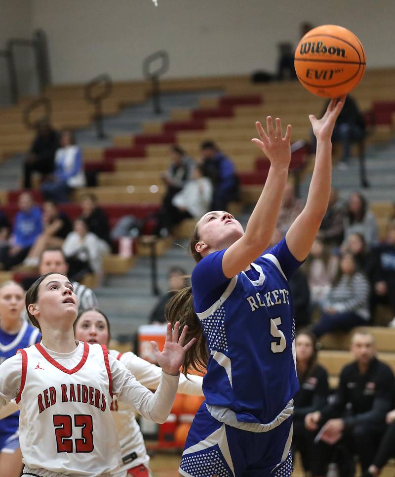 Burlington Central's Audrey LaFleur drives tot eh basket again Huntley's Aubrina Adamik during a Fox Valley Conference girls basketball game on Tuesday Jan. 13, 2026, at Huntley High School.