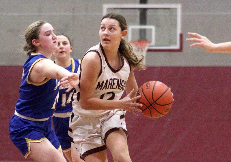 Marengo’s Gabby Gieseke heads to the hoop against Johnsburg in varsity girls basketball at Marengo Tuesday night.