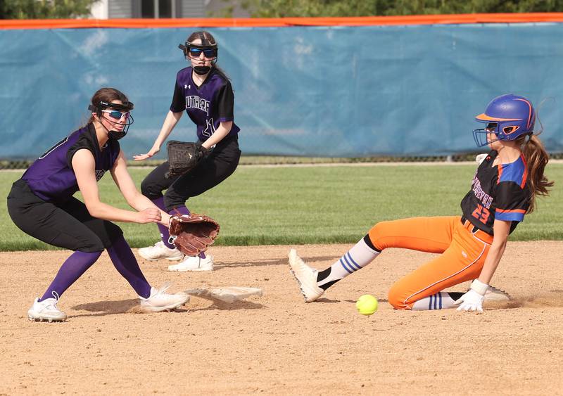 Genoa-Kingston's Faith Thompson slides in safely with a stolen base as Rockford Lutheran's Reese Landin takes the throw during their Class 2A Regional quarter final game Monday, May 15, 2023, at Genoa-Kingston High School.