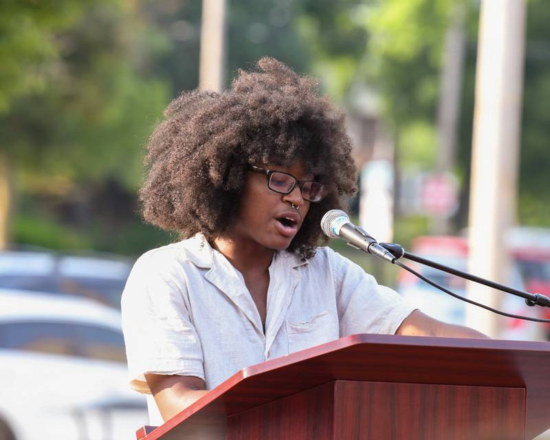 Ezekiel Alexander, a Northern Illinois University student, speaks during DeKalb Pride Fest held outside the Egyptian Theatre, 135 N. Second St. in DeKalb Thursday June 22, 2023.