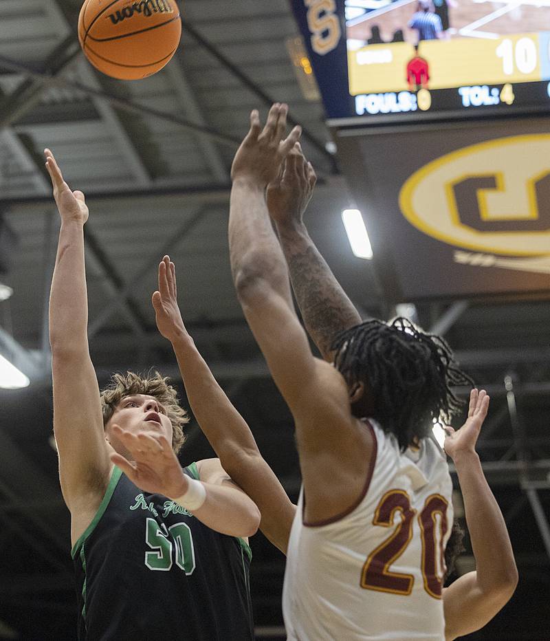 Rock Falls’ Cole Mulnix puts up a shot against Christ the King’s Aaron McClure Monday, March 10, 2025, during the Class 2A boys basketball Supersectional in Sterling.