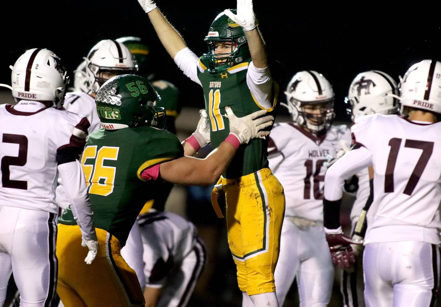 Crystal Lake South’s Nathan Van Witzenburg gets a lift from teammate Andy Burburija after a touchdown against Prairie Ridge in varsity football action at Ken Bruhn Field on the campus of Crystal Lake South Friday evening.