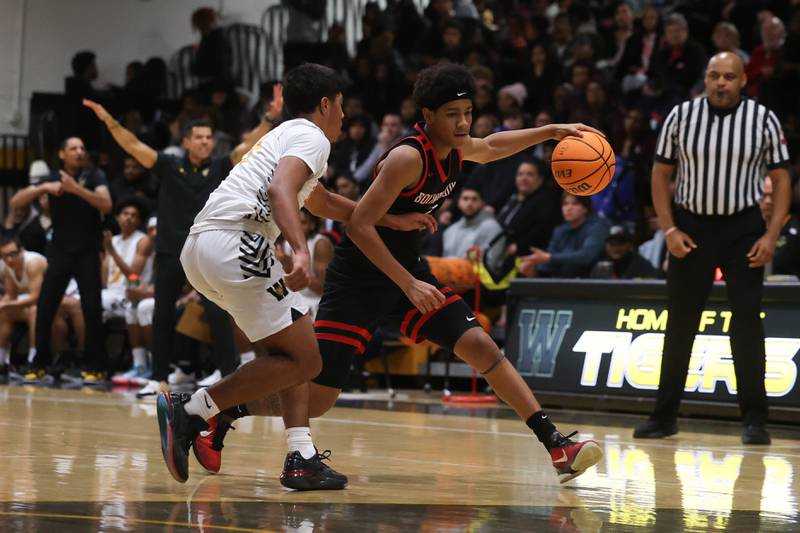 Bolingbrook’s Davion Thompson drives to the paint against Joliet West on Friday, Jan 24, 2025 in Joliet.