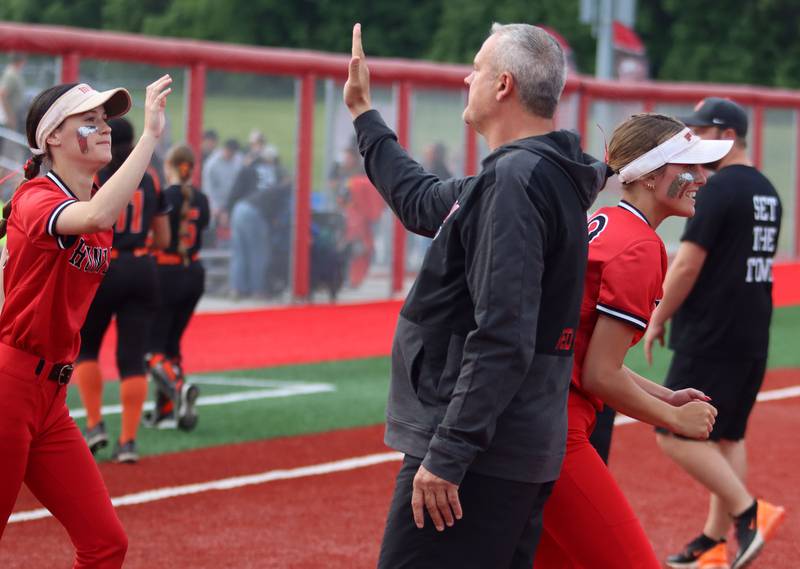 Huntley’s Head Coach Mark Petryniec greets the Red Raiders after a win over DeKalb in IHSA Class 4A Sectional Semifinal softball action at Barrington High School in Barrington on Wednesday, June 4, 2025.
