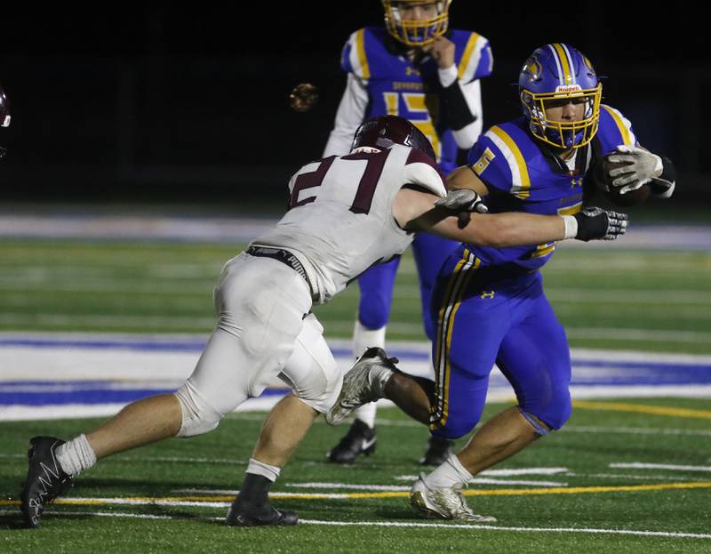 Marengo's Connor Sacco tackles Johnsburg's Brett Centnarowicz during a Kishwaukee River Conference football game on Friday, Oct. 4, 2024, at Johnsburg High School.