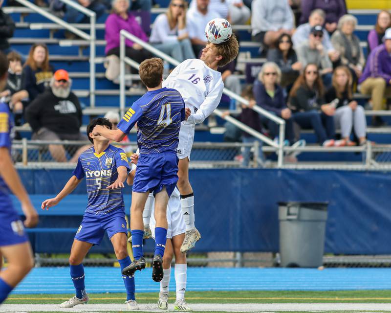 Downers Grove North's Oliver Davies (16) heads the ball during Class 3A Lyons Regional final soccer match.  Oct 21, 2023.