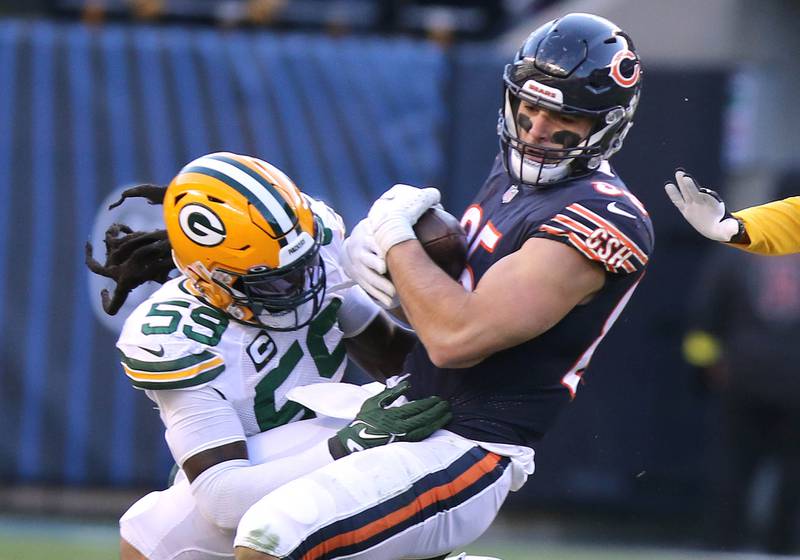 Chicago Bears tight end Cole Kmet makes a catch before being brought down by Green Bay Packers linebacker De'Vondre Campbell during their game Sunday, Dec. 4, 2022, at Soldier Field in Chicago.