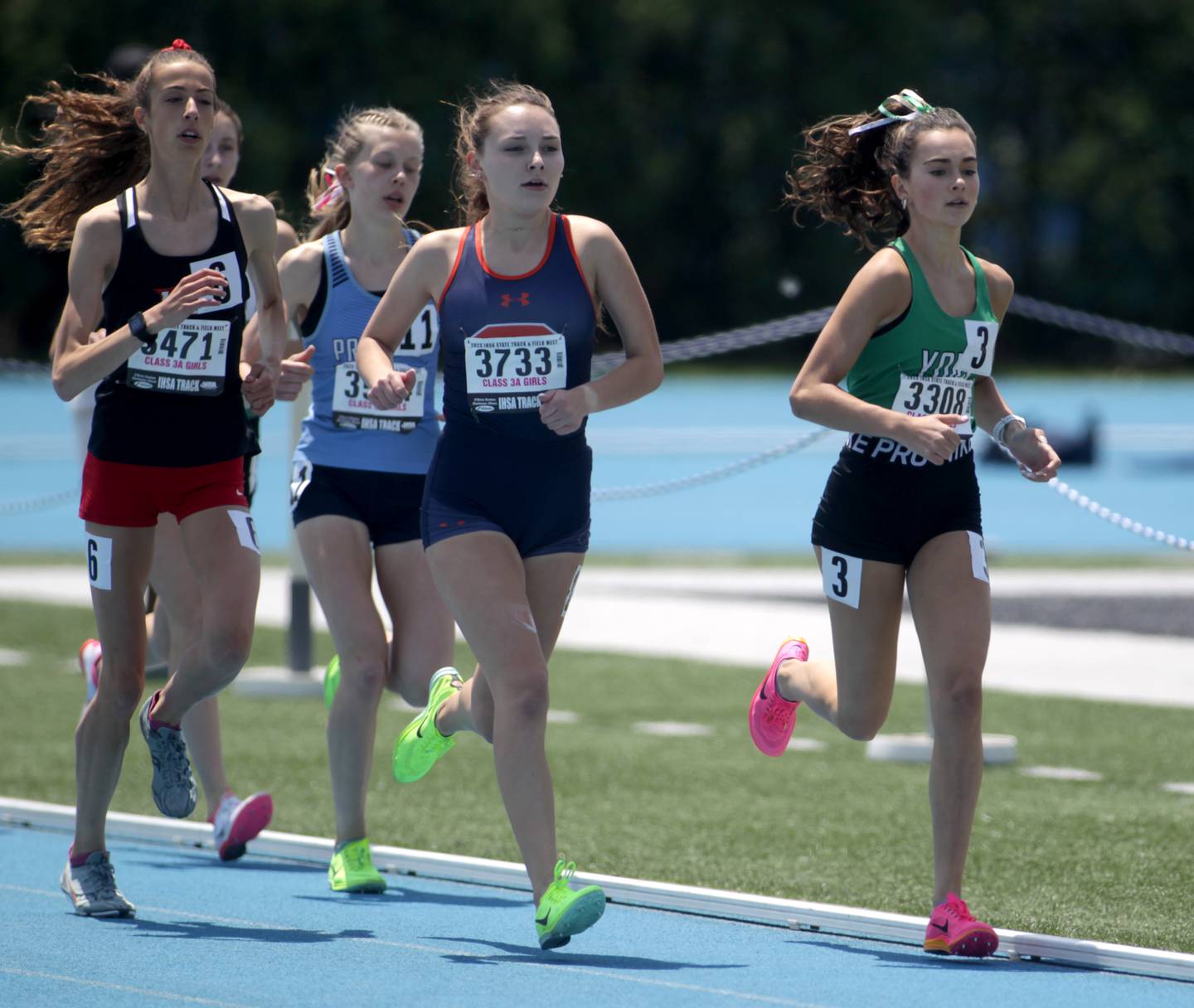 York’s Bria Bennis (right) competes in the 3A 3200-meter run during the IHSA State Track and Field Finals at Eastern Illinois University in Charleston on Saturday, May 20, 2023.