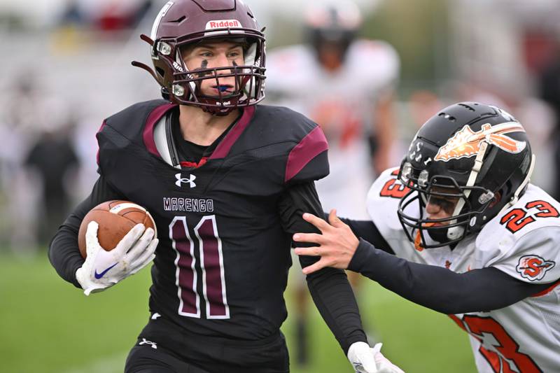 Marengo's Alten Bergbreiter tries to avoid Sandwich's Jimmy Ramey for short yardage during their Kishwaukee River Conference game on Saturday, Oct. 14, 2023 in Marengo.