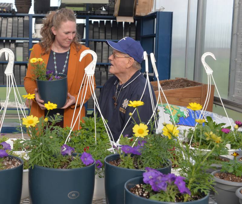 Stephanie Schultz chats with Bill Burkardt, one of the benefactors for Polo High School's new greenhouse during the facility's ribbon cutting ceremony on Wednesday, May 1, 2024. The 42'x72' structure is located just to the east of the Ag shop at Polo High School.