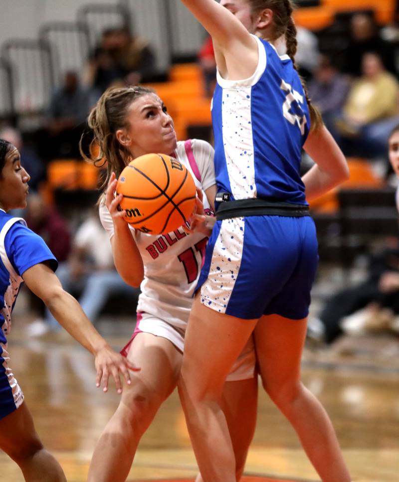 Batavia's Kaidyn King looks for a shot around the Wheaton North defense during a Class 4A St. Charles East Sectional semifinal against on Tuesday, Feb. 25, 2025 in St. Charles.