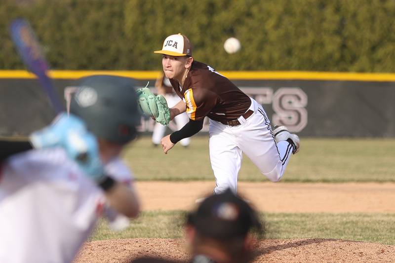 Joliet Catholic’s Anthony Kilimnik delivers a pitch against Lincoln-Way Central on Wednesday, March 25, 2026 in New Lenox.