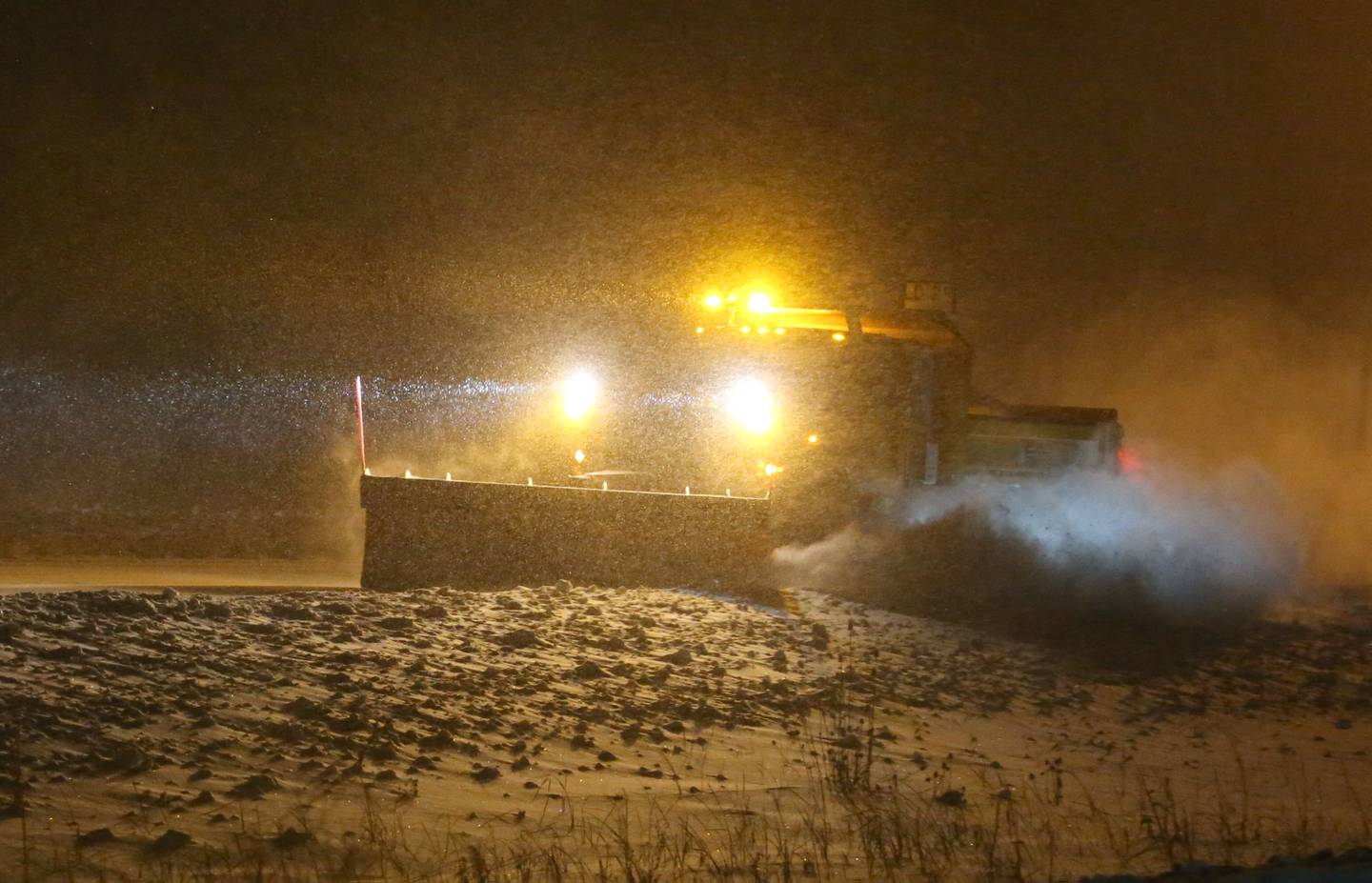 A snowplow pushes snow on Interstate 80 on Thursday, Jan. 18, 2024 in Bureau County.