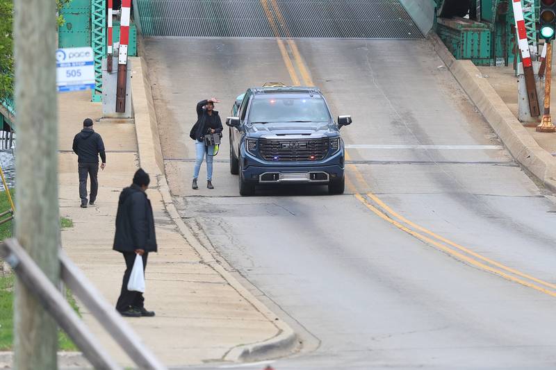 An unmarked police pickup truck waits along Jackson street to film a scene on Monday, April 27, 2026 in Joliet. HBO began filming the pilot for “American Blue” that follows a police chief retuning to Joliet to take over the police department.