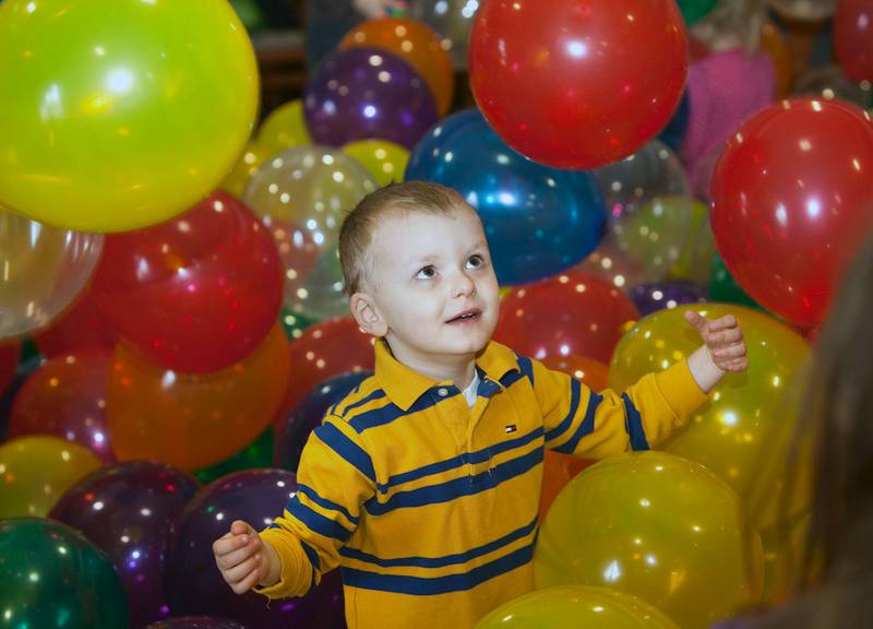 Daniel Wolas, 3, of Plainfield, plays in the balloon pit at the Hippity-Hop Easter Egg Hunt on April 4 at The Timbers of Shorewood retirement community in Shorewood,