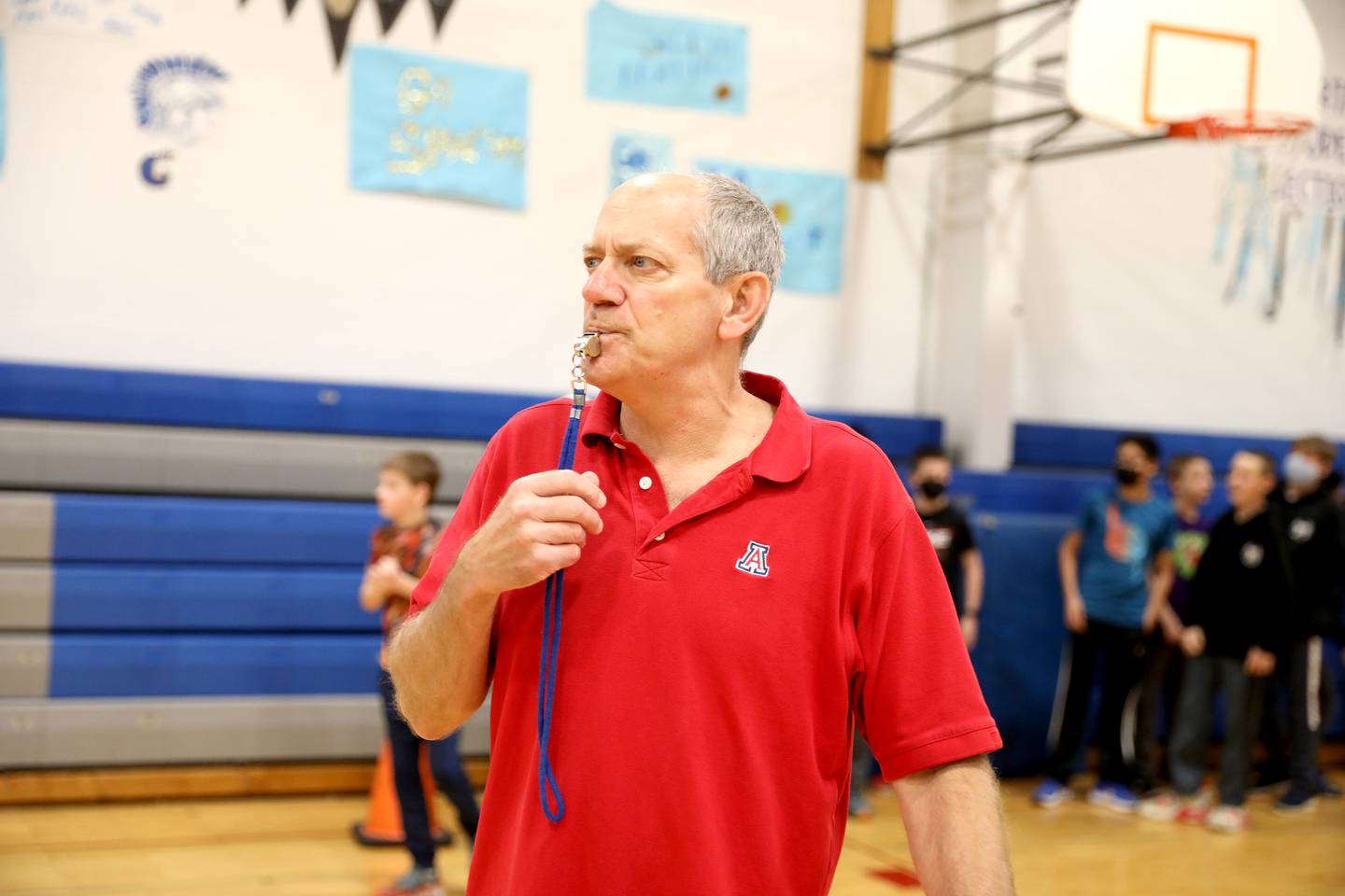 Physical education teacher Corey Toppel teaches a lesson on the shot put to sixth graders at Glen Crest MIddle School in Glen Ellyn. Toppel has been a teacher at the school for 32 years.