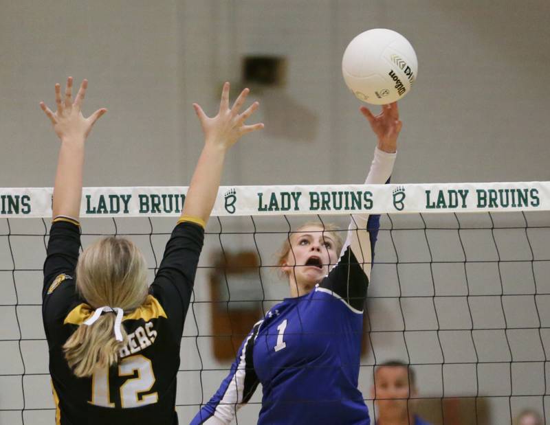 Newark's Addison Ness (1) sends the ball past Putnam County's Tori Balma (12) in the Class 1A semifinal game on Wednesday, Oct. 16, 2022 at St. Bede Academy in Peru.