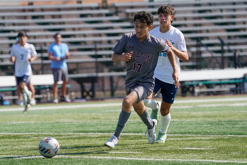 Morton’s Moises A Malvaez (17) pushes the ball up the field on a fast break against Downers Grove South during a soccer match at Morton High School in Berwyn on Saturday, Oct. 5, 2024.