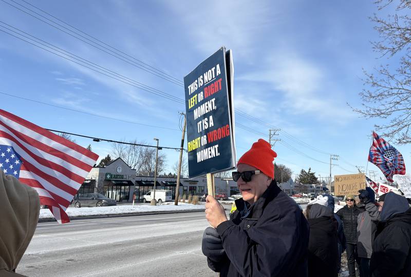 Ralph Iden holds a sign at a protest in McHenry Feb. 1, 2026.