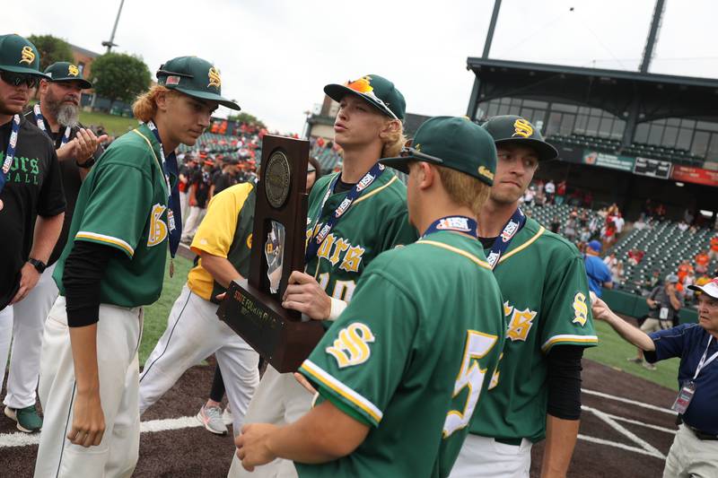 Crystal Lake South players receive the fourth-place trophy after their 2-1 loss against Washington in the IHSA Class 3A third-place game, Saturday, June 11, 2022 in Joliet.