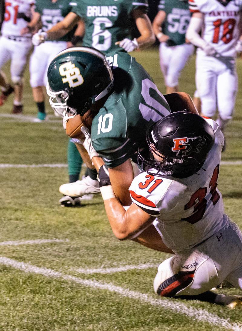 Erie-Prophetstown's Jase Grunder tackles St. Bede's Calym Setser (10) on Friday, Sept. 2, 2022 in Peru.