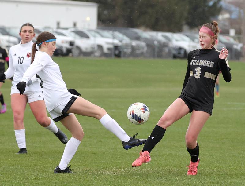 La Salle-Peru's Lilyana Hernandez tries to kick the ball by Sycamore's Marin Gautcher during their game Wednesday, April 9, 2025, at Sycamore High School.