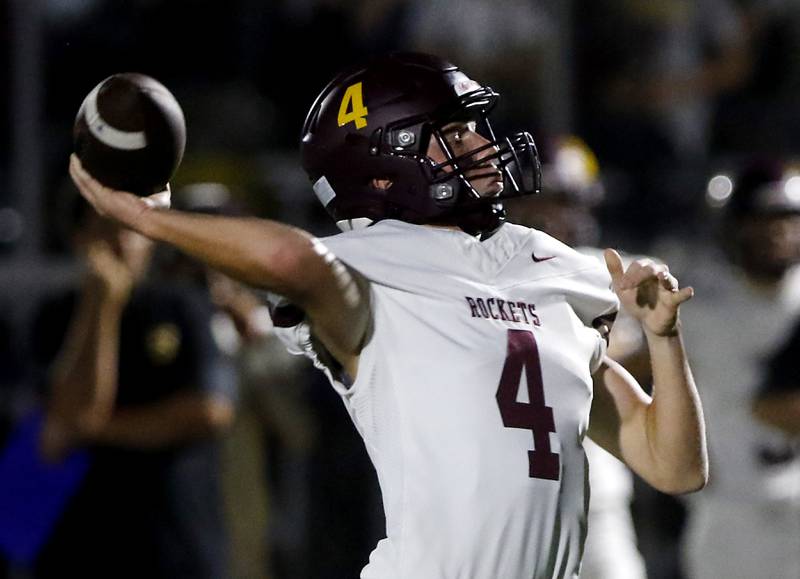 Richmond-Burton's Ray Hannemann throws  a touchdown pass during a Kishwaukee River Conference football game against Johnsburg on Friday, Sept. 12, 2025, at Johnsburg High School.