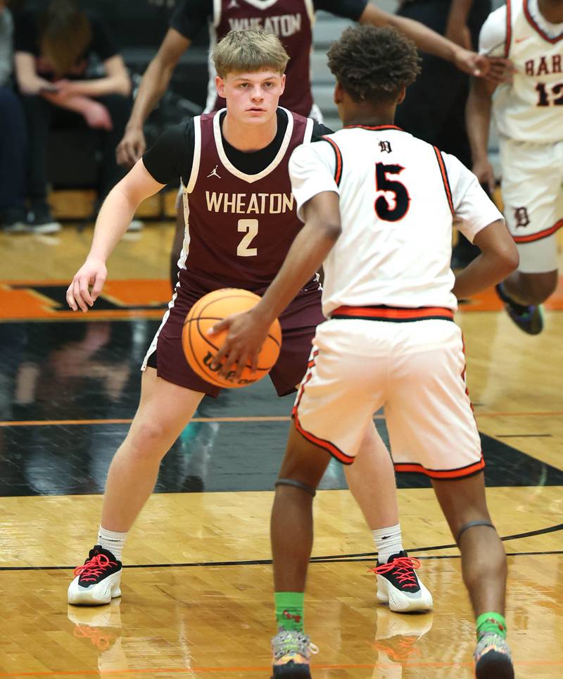 Wheaton Academy's Tyler Anderson plays defense against DeKalb's Bryan Miller during their game Wednesday, Jan. 14, 2026, at DeKalb High School.