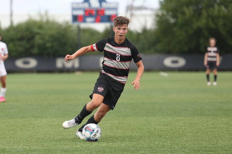 Lincoln-Way Central’s John Roussakis works the ball against Lincoln-Way West in the Windy City Classic at Revis High School in Burbank on Saturday, Aug. 26, 2023.