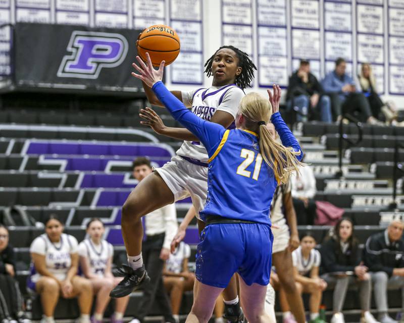 Plano's Sanai Young (2) makes a pass into the post during their basketball game between Johnsburg at Plano, Monday Dec 16, 2024 in Plano.