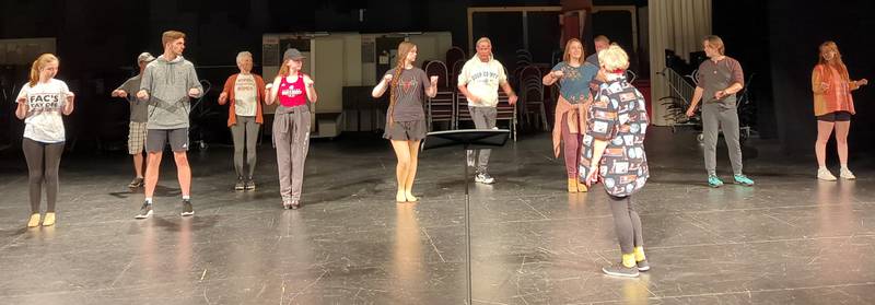 The cast of Illinois Valley Community College's "MAME!" goes through a dance rehearsal.