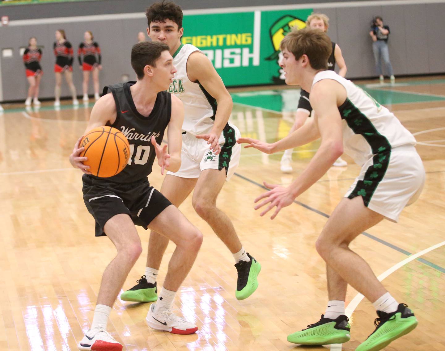 Woodland's Jaron Follmer is double teamed by Seneca's Brayden Simek and Cameron Shriey on Friday, Feb. 14, 2025 at Seneca High School.