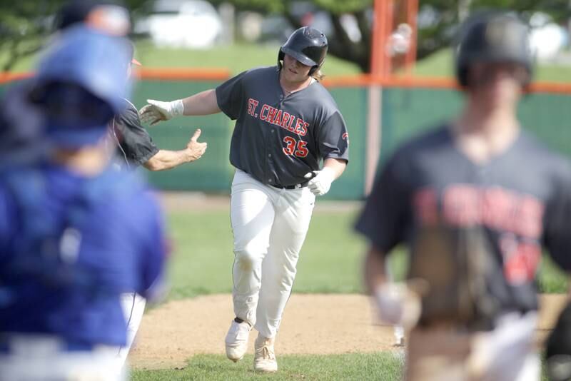 St. Charles East’s James Brennan makes his way to home plate following a homerun during a home game against Wheaton North on Monday, May 15, 2023.