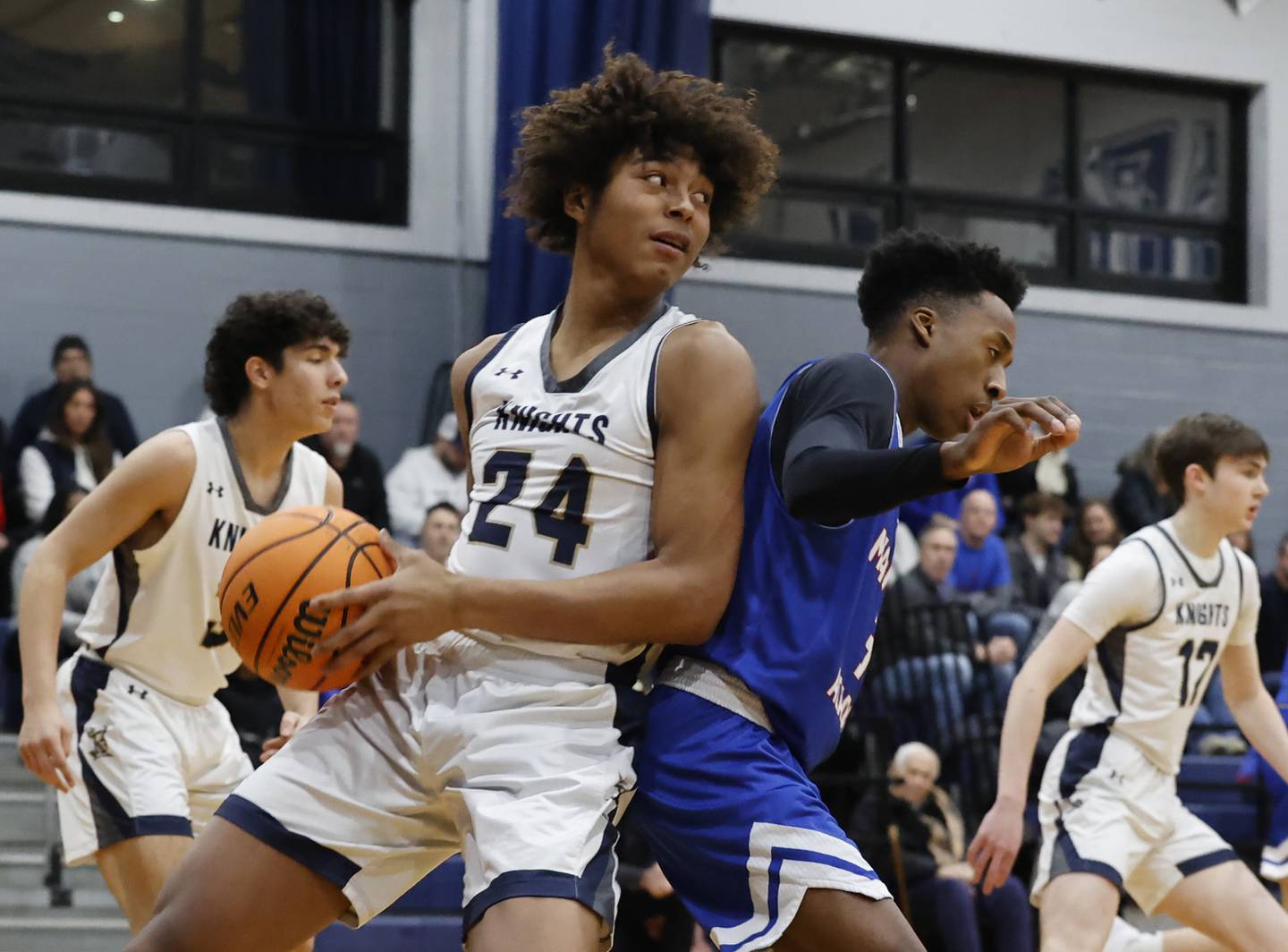 IC's Donnell Sallis (24) grabs a rebound during the boy's varsity basketball game between Marmion Academy and IC Catholic Prep on Friday, Jan. 30, 2026 in Elmhurst, IL.