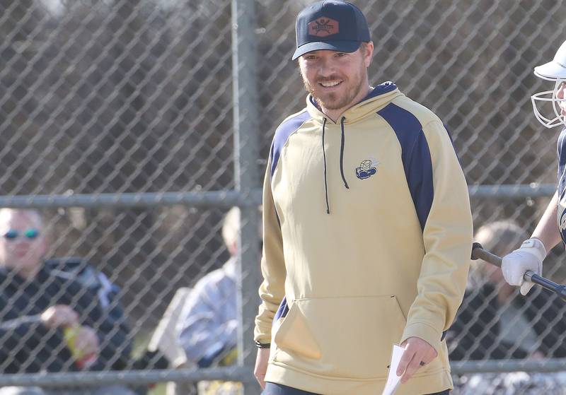 Marquette head softball coach Brian McCallum smiles while coaching his team agaisnt Serena on Wednesday, March 26, 2025 at Serena High School.