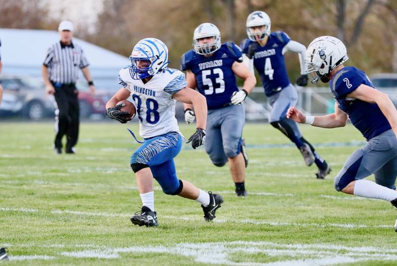 Princeton's Preston Arkels breaks loose on a run Saturday at Monmouth. The Tigers won 35-0.