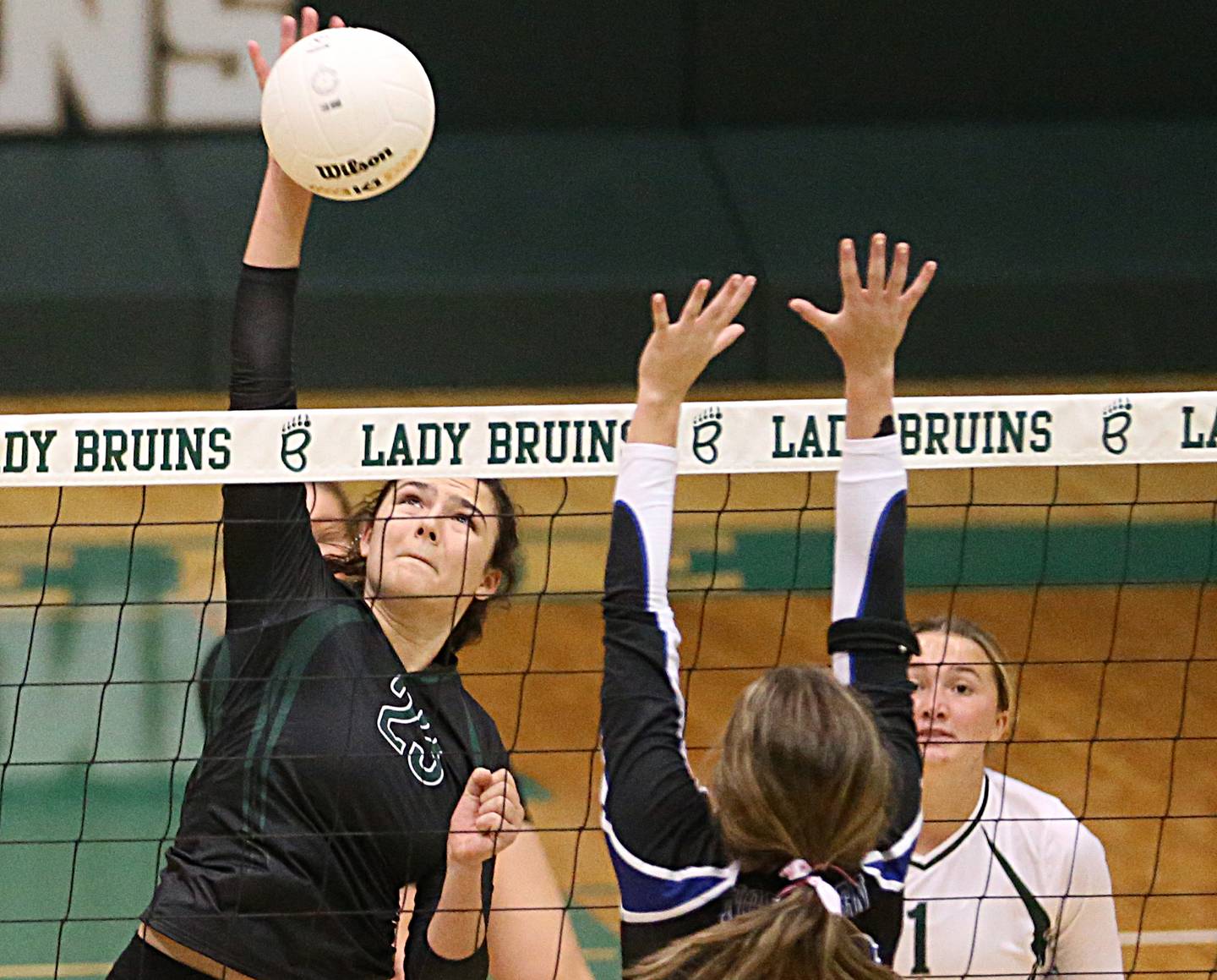 St. Bede's Ali Bosnich (23 spikes the ball past Newark's Kodi Rizzo (10) in the Class 1A Regional title game on Thursday, Oct. 27, 2022 at the Academy in Peru.