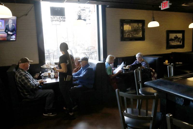 People dine on Tuesday, Nov. 12, 2024, at Squire on the Square in Woodstock. The restaurant, which has similar decor as other Village Squire restaurants, is a joint venture between the Linardos family and Bob Karas of Karas Restaurant Group.

Squire on the Square is located in the basement of the Old Courthouse in Woodstock, and its menu will features items similar to the Linardos family’s restaurants and the Village Squire.  

The eatery replaces the Public House that closed at the end of March.