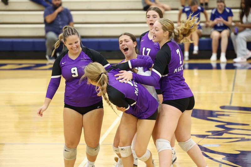 Manteno's Maddy Belisle, front center, is celebrated by teammates from left, Leah Donnelly, Morgan Derrico, Emily Horath and Leah Milton after earning the winning point in the second set during the Panthers' victory in three sets, 19-25, 25-19, 25-21, over Peotone on Tuesday, Sept. 23, 2025.