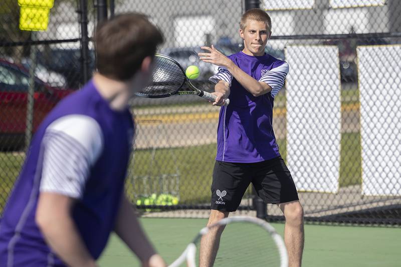 Dixon doubles player Derek Miller returns a shot against Sterling in a tennis match Thursday, May 4, 2023.