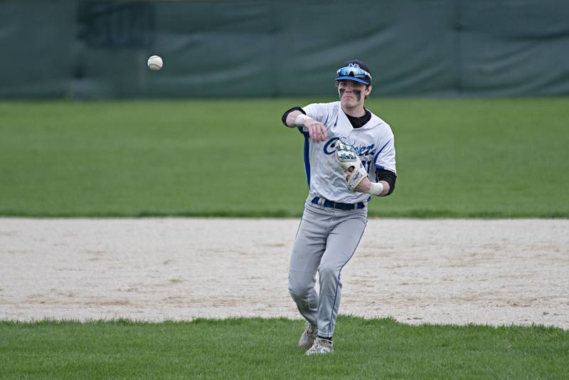 Newman’s Nolan Britt throws to first for an out against Princeton Monday, May 2, 2022.