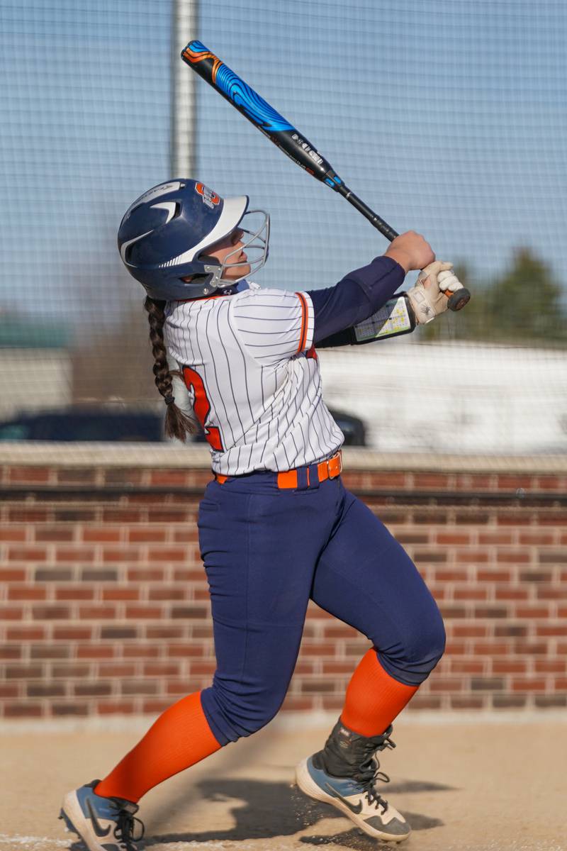 Oswego’s Aubriella Garza (12) hits a two run homer against Downers Grove South during a softball game at Oswego High School on Tuesday, March 19, 2024.