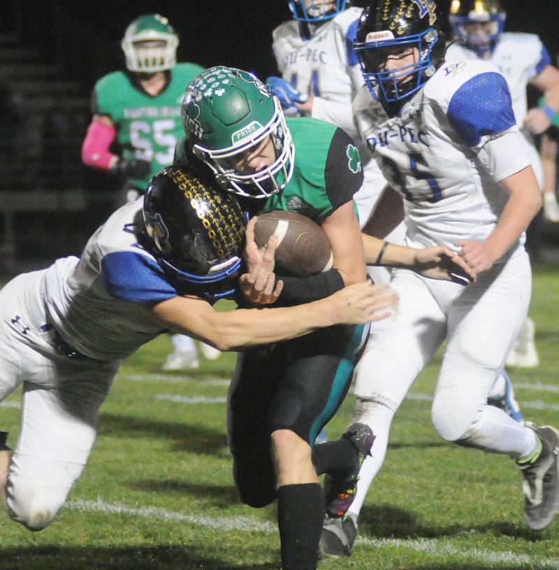 Dupec's Justin Anderson tackles Seneca quarterback Paxton Giertz on Friday, Oct. 24, 2024.