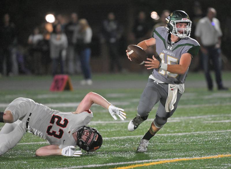 Stevenson quarterback Aiden Crawley gets away from  Libertyville’s Caleb Baczek in a football game in Lincolnshire on Friday, Sept. 13, 2024.