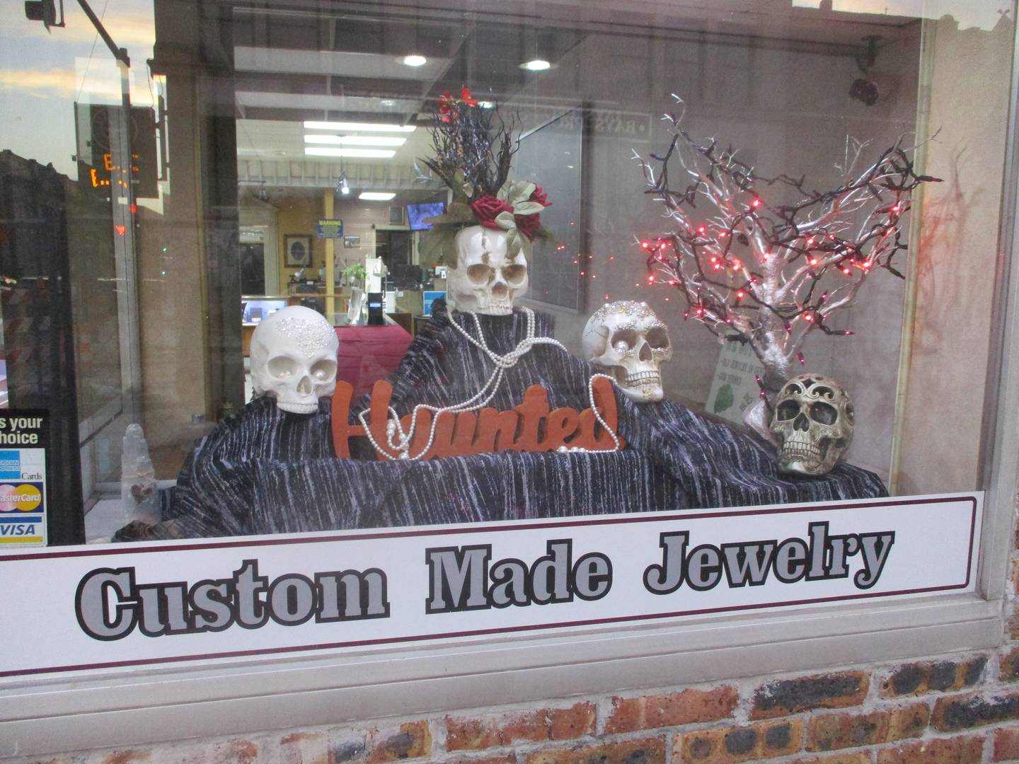Skulls decorate the front wonder of J&M Jewelers in downtown Joliet. Oct. 30, 2024