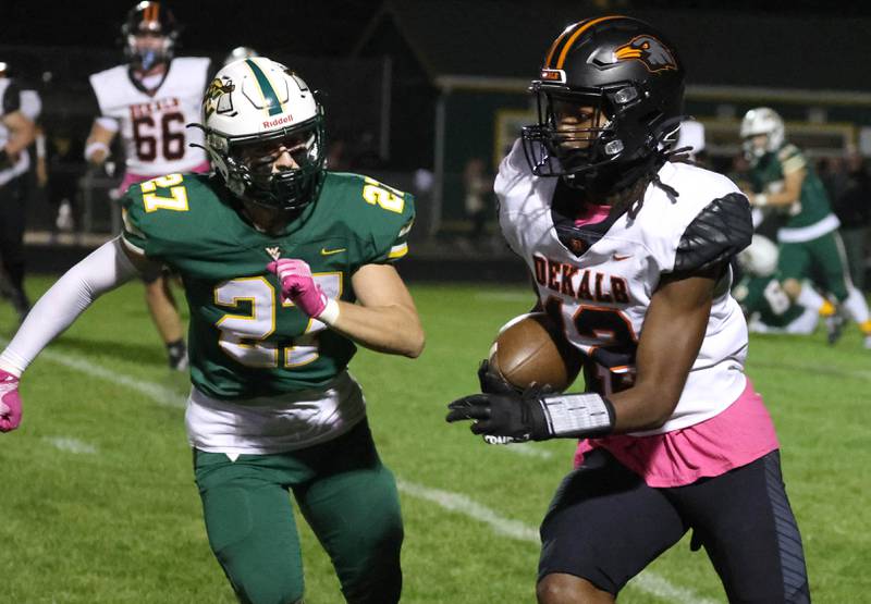 DeKalb's Derrion Straughter tries to get outside of Waubonsie Valley’s Nate Cerilli during their game Friday, Oct. 11, 2024, at Waubonsie Valley High School in Aurora.